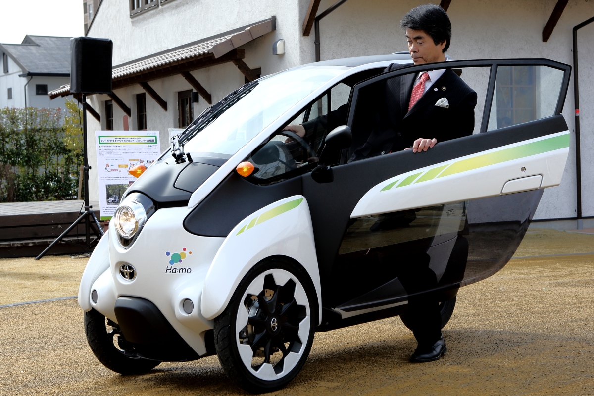 Toshihiko Ota, mayor of Toyota City, takes a spin in a Toyota i-Road