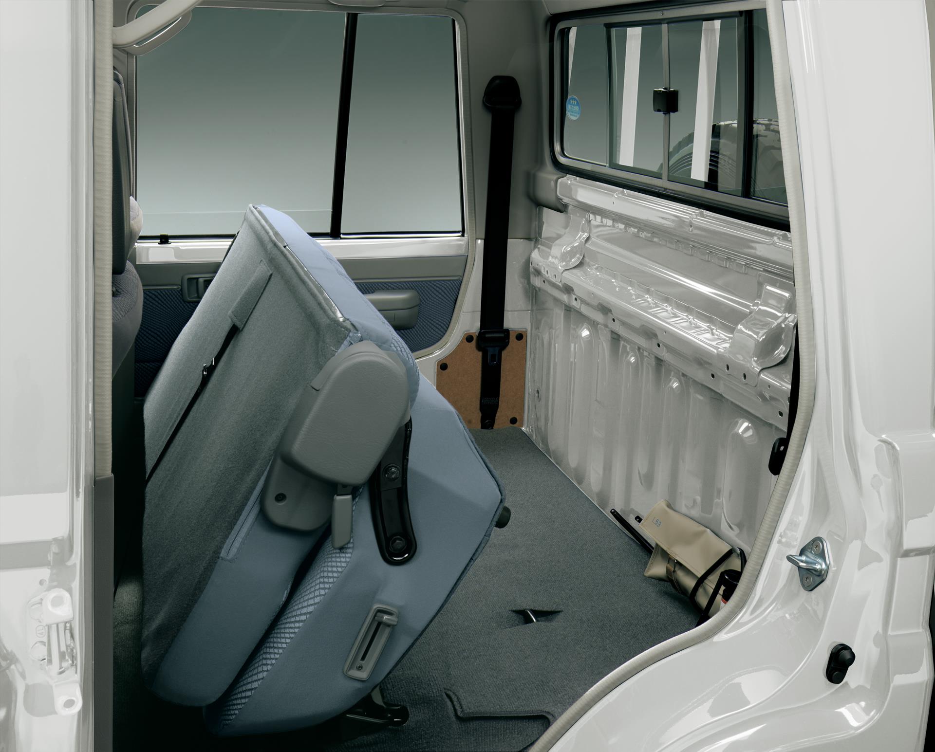 Land Cruiser 70 pickup rear bench seats in stowed position (Japan commemorative re-release)